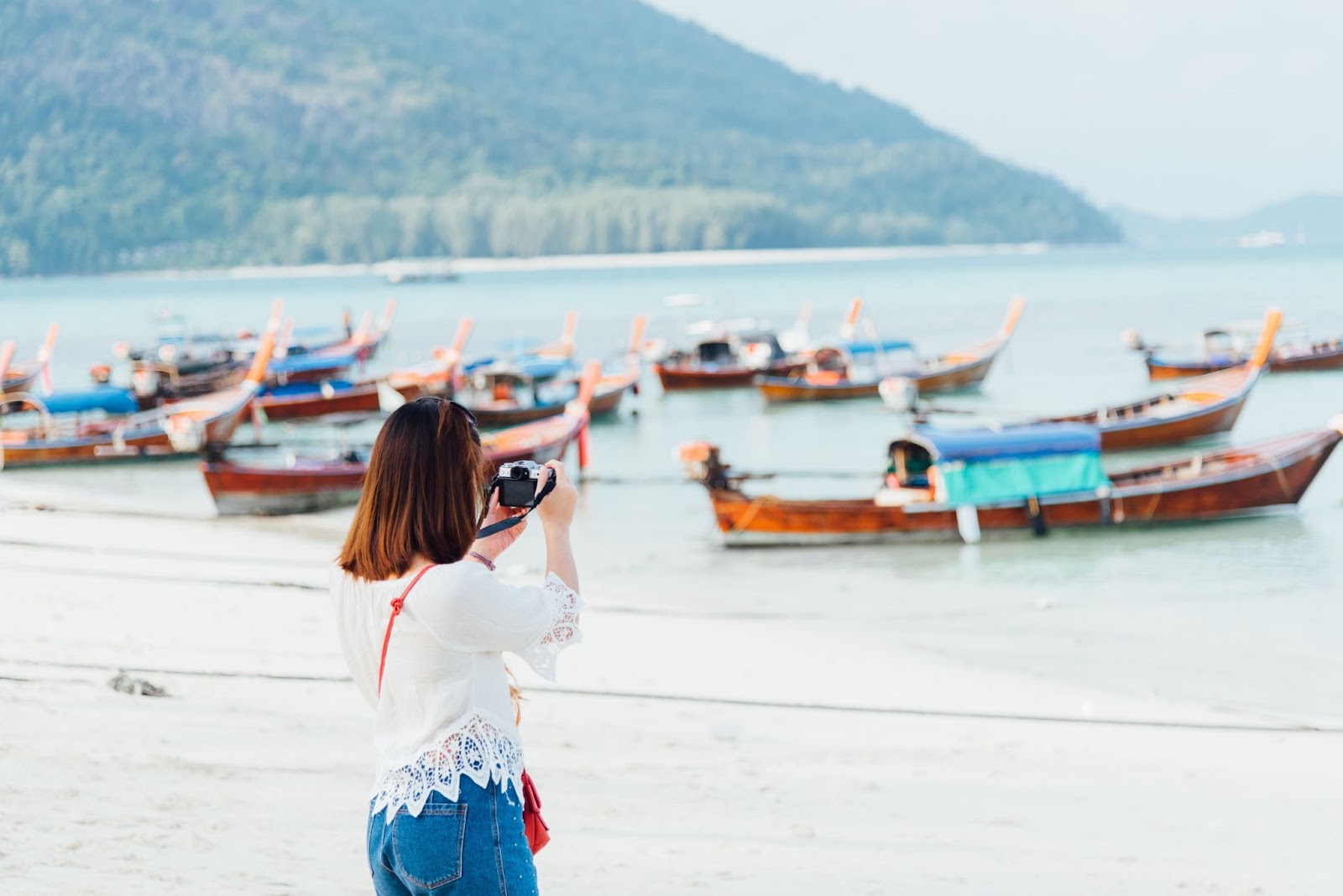 asia girl take photo on the beach