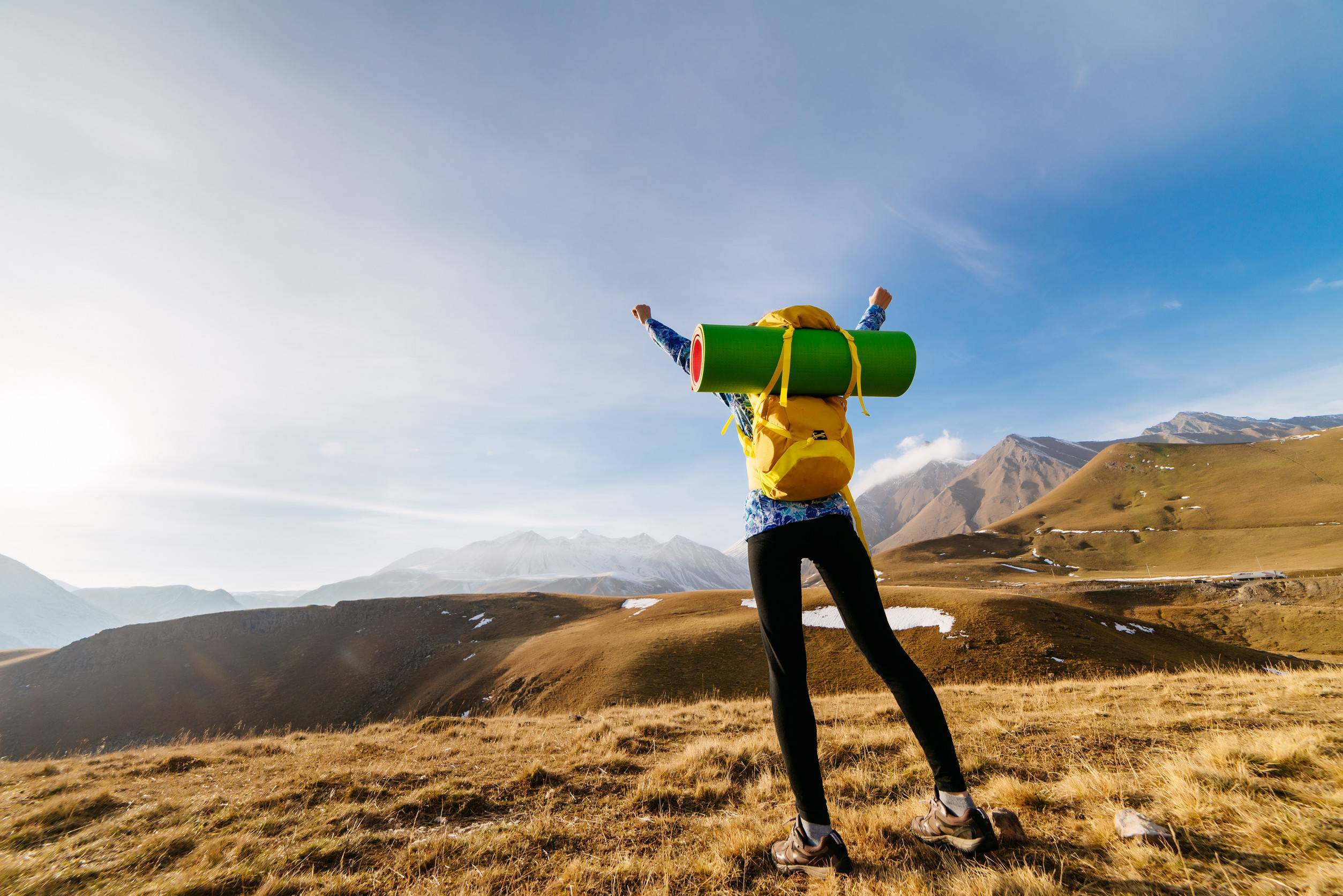 Active Young Girl Travels Through The Caucasus Mountains With A Backpack