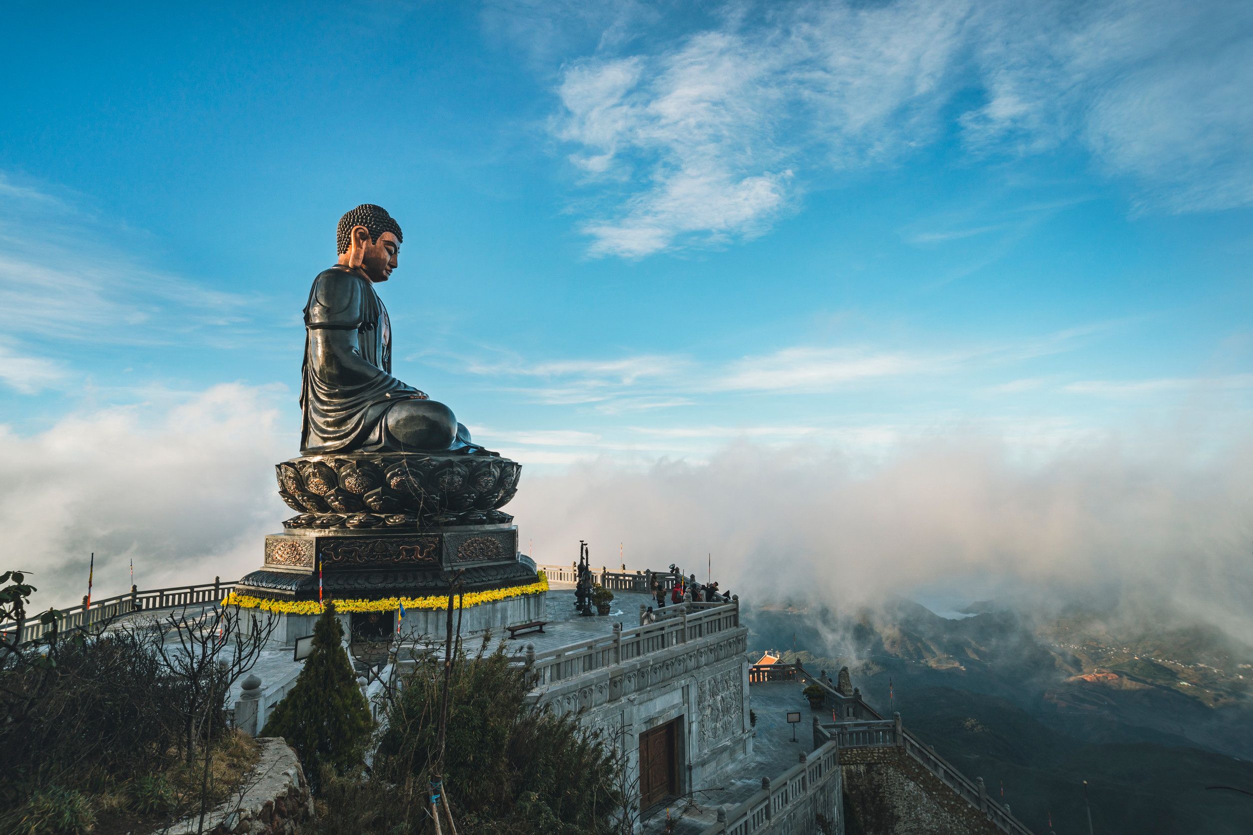 Buddha Statue On Top At Sunset In The Clouds Big Buddha Statue At The Top Of Fansipan Buddha Statue On Top At Sunset In The Clouds Big Buddha Statue At The Top Of Fansipan