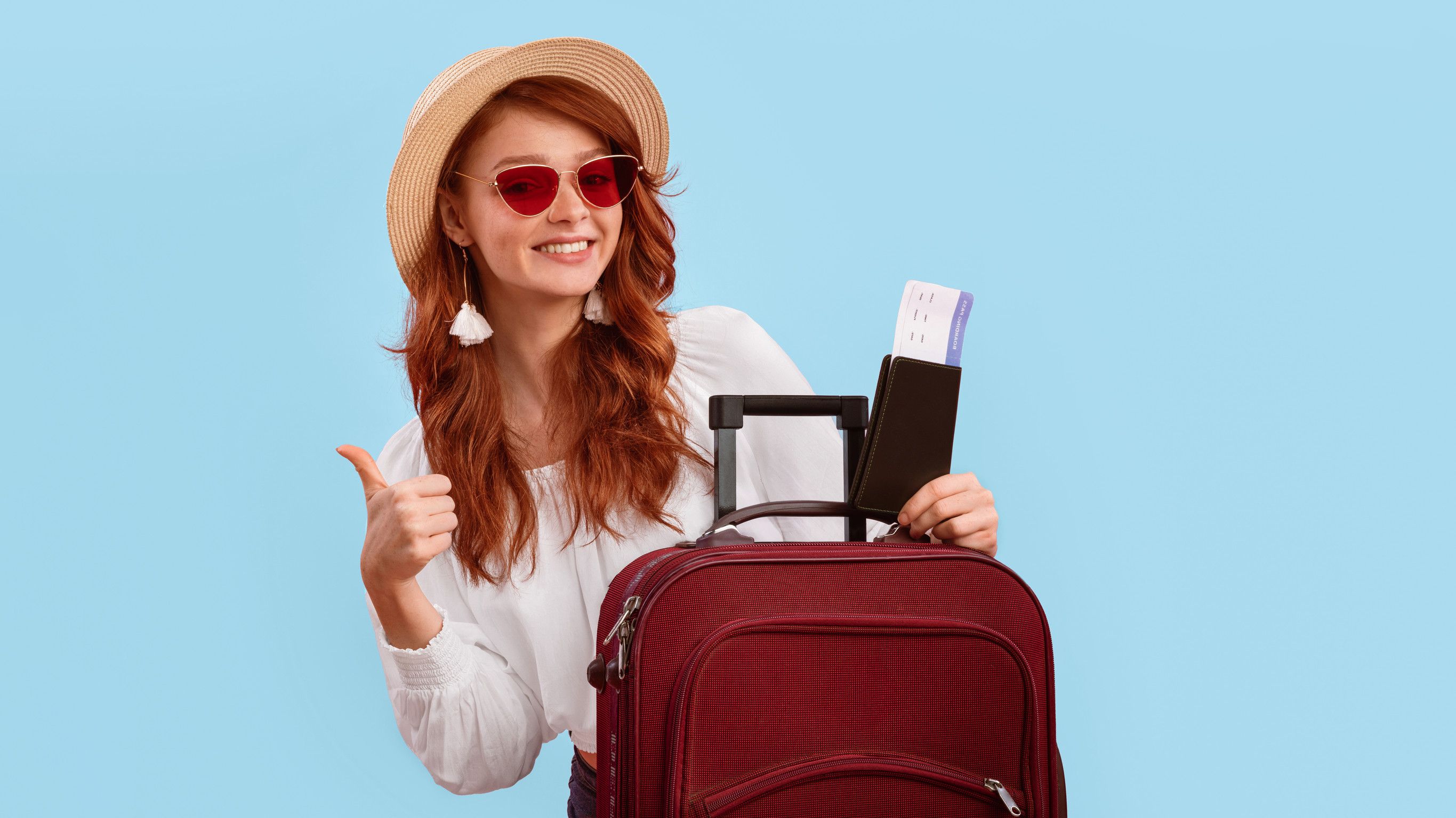 Girl Posing With Tickets And Passport Gesturing Thumbs Up Pink Background