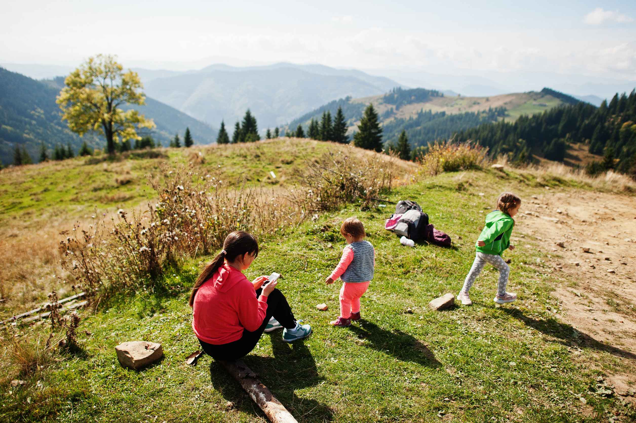 Mother With Daughters Enjoying In The Mountains The Concept Of Family Travel Adventure