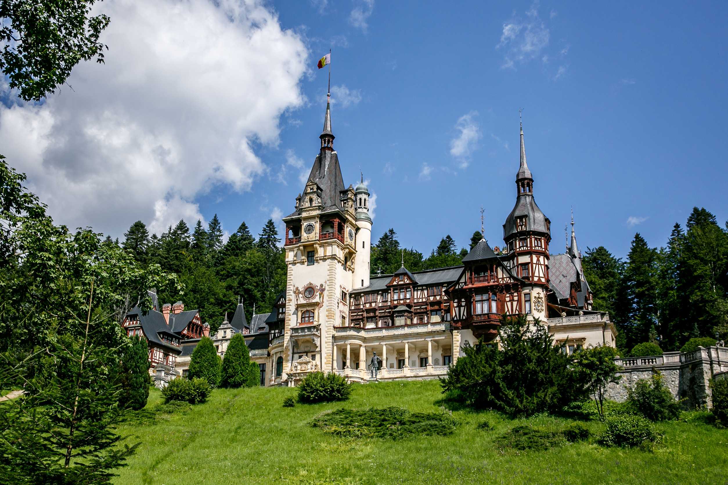 Peles Castle In Romania Europe Blue Sky Green Grass Summer Peles Castle In Romania Europe Blue Sky Green Grass Summer