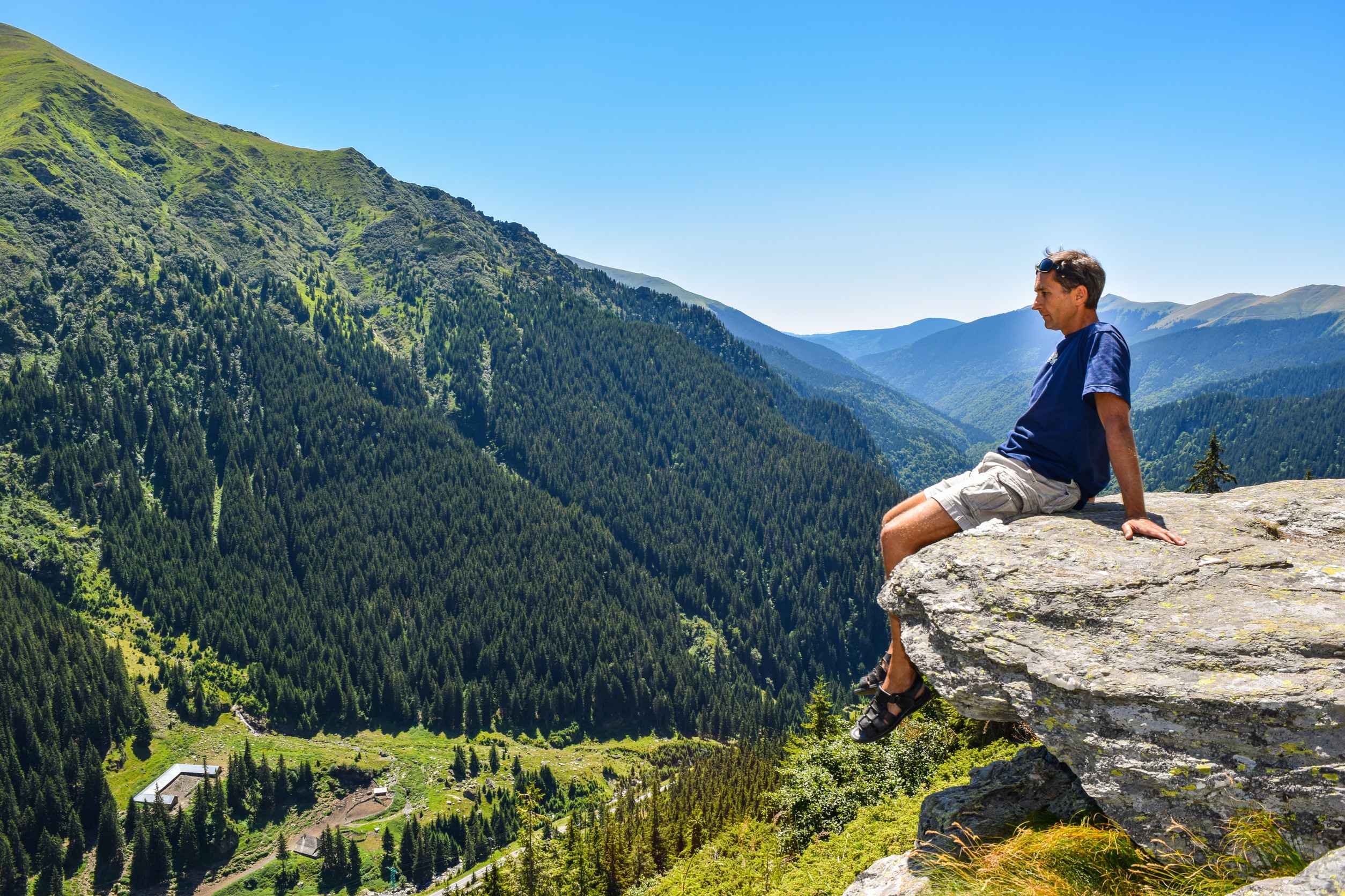 Tourist On The Cliff Edge Near Transfegerasan Mountain Road