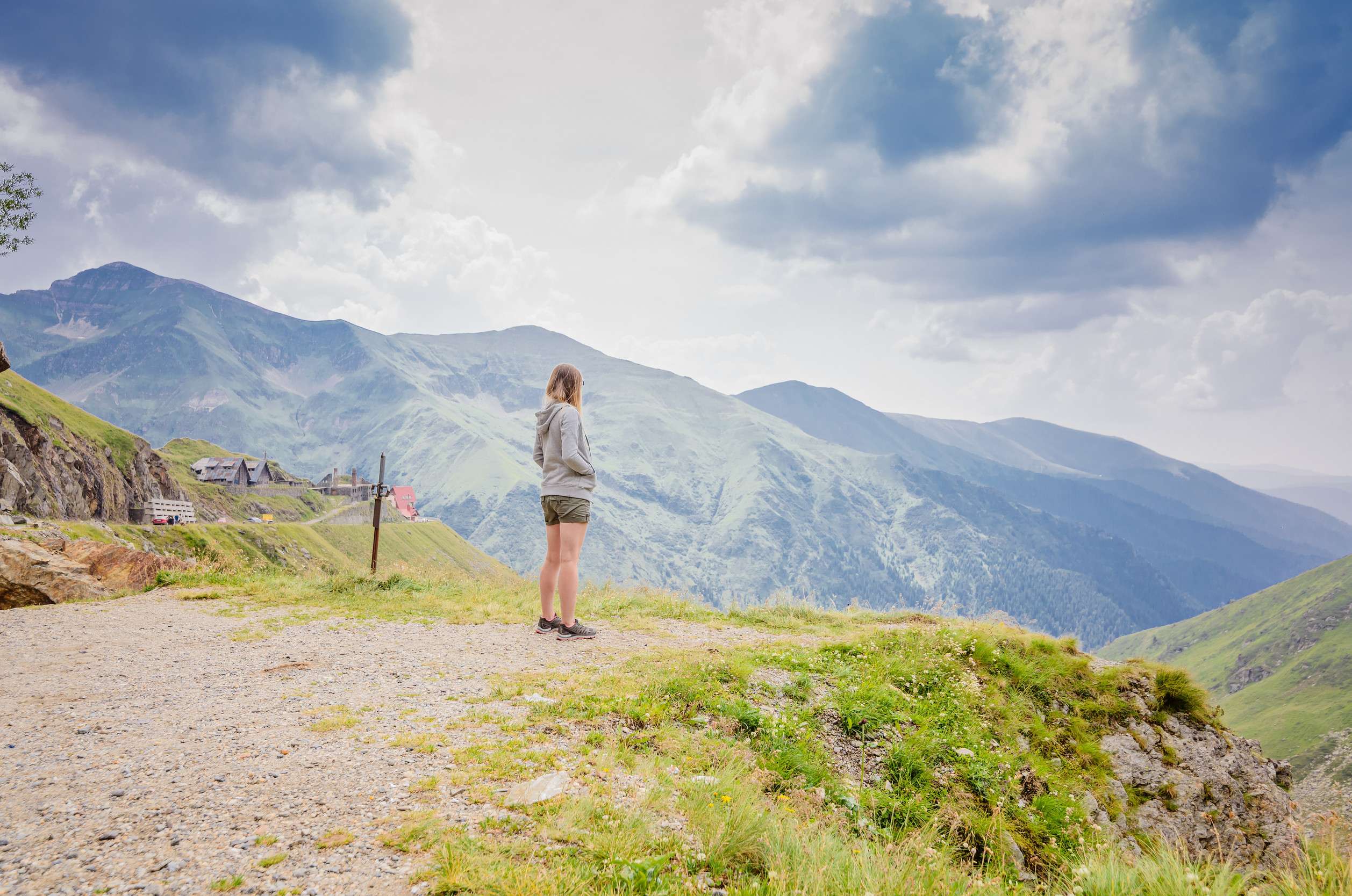 Young Woman On Cliff S Edge In Romanian Carpathian Mountains