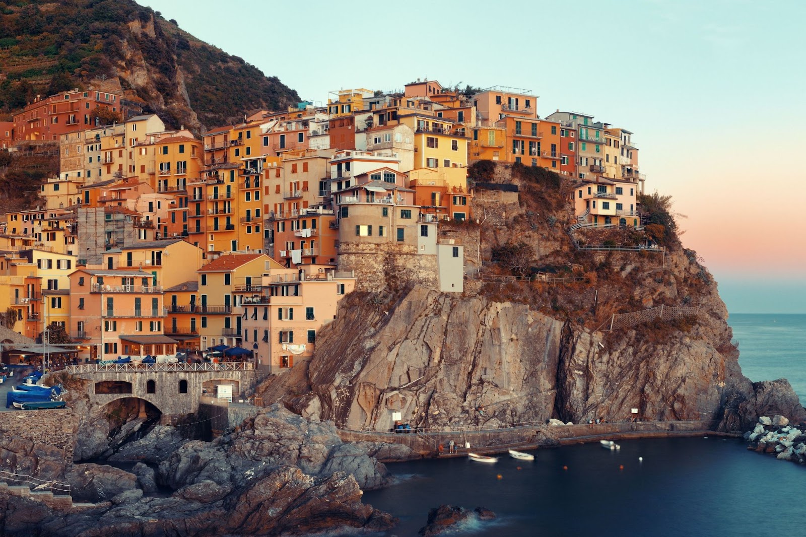 Manarola overlook Mediterranean Sea with buildings over cliff in Cinque Terre, Italy