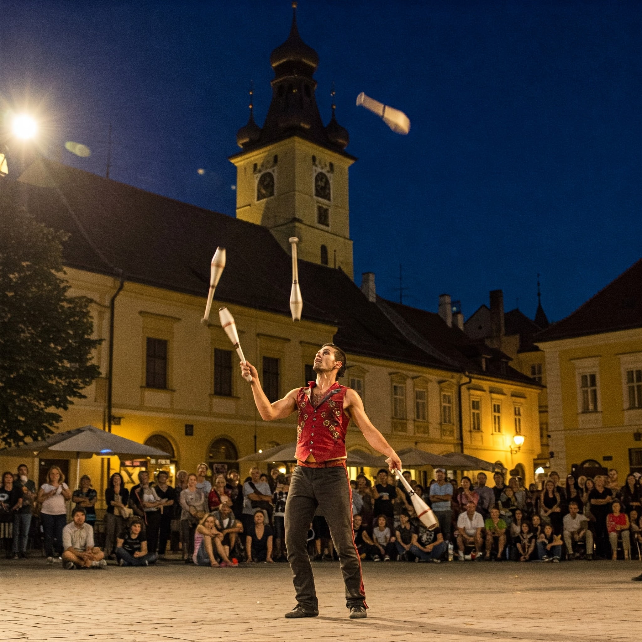 A member of Kinemtatos, Manoamano Circo, Argentina performing a trick in the Little Square during Sibiu International Theatre Festival, Sibiu, Romania